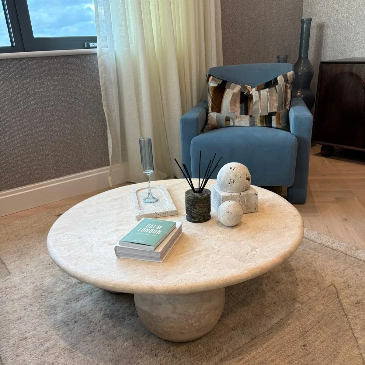 Light Travertine coffee table: round bullnose coffee table with rounded central pedestal