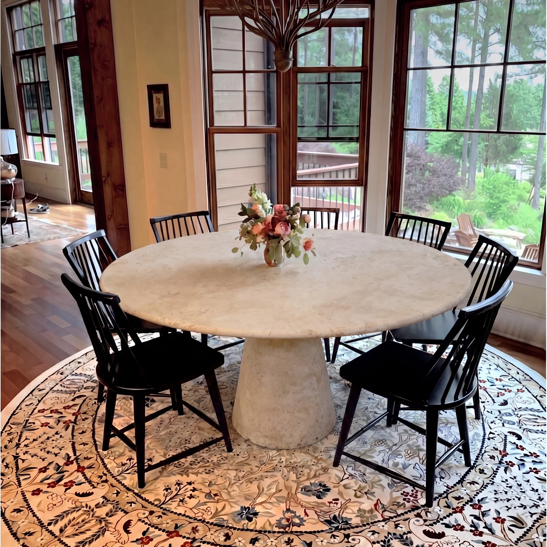 Limyra Dining Table in Light Travertine: round top and tapered conical pedestal