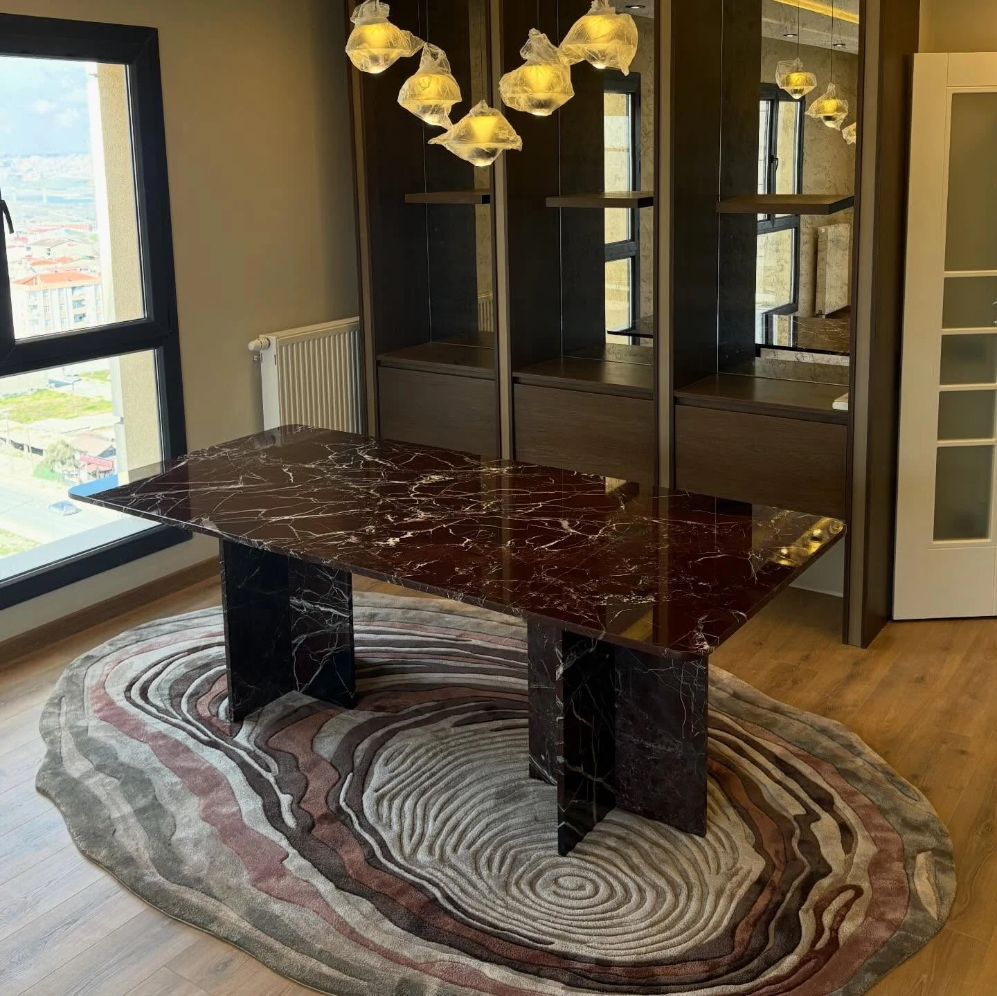Rosso Levanto marble dining table: thin rectangular top with paired slab legs