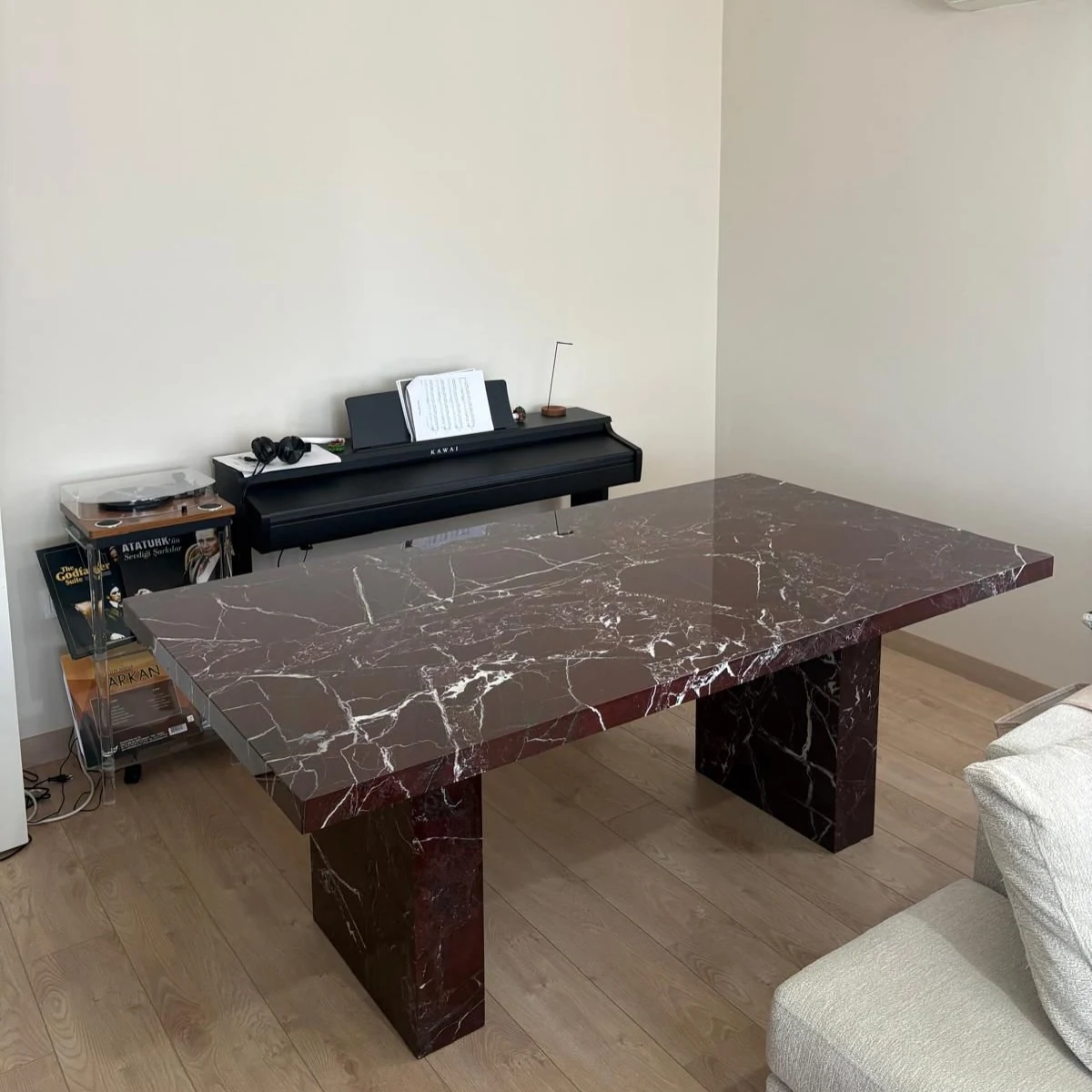 Alinda Dining Table in Rosso Levanto marble: rectangular table with thick top and two slab legs