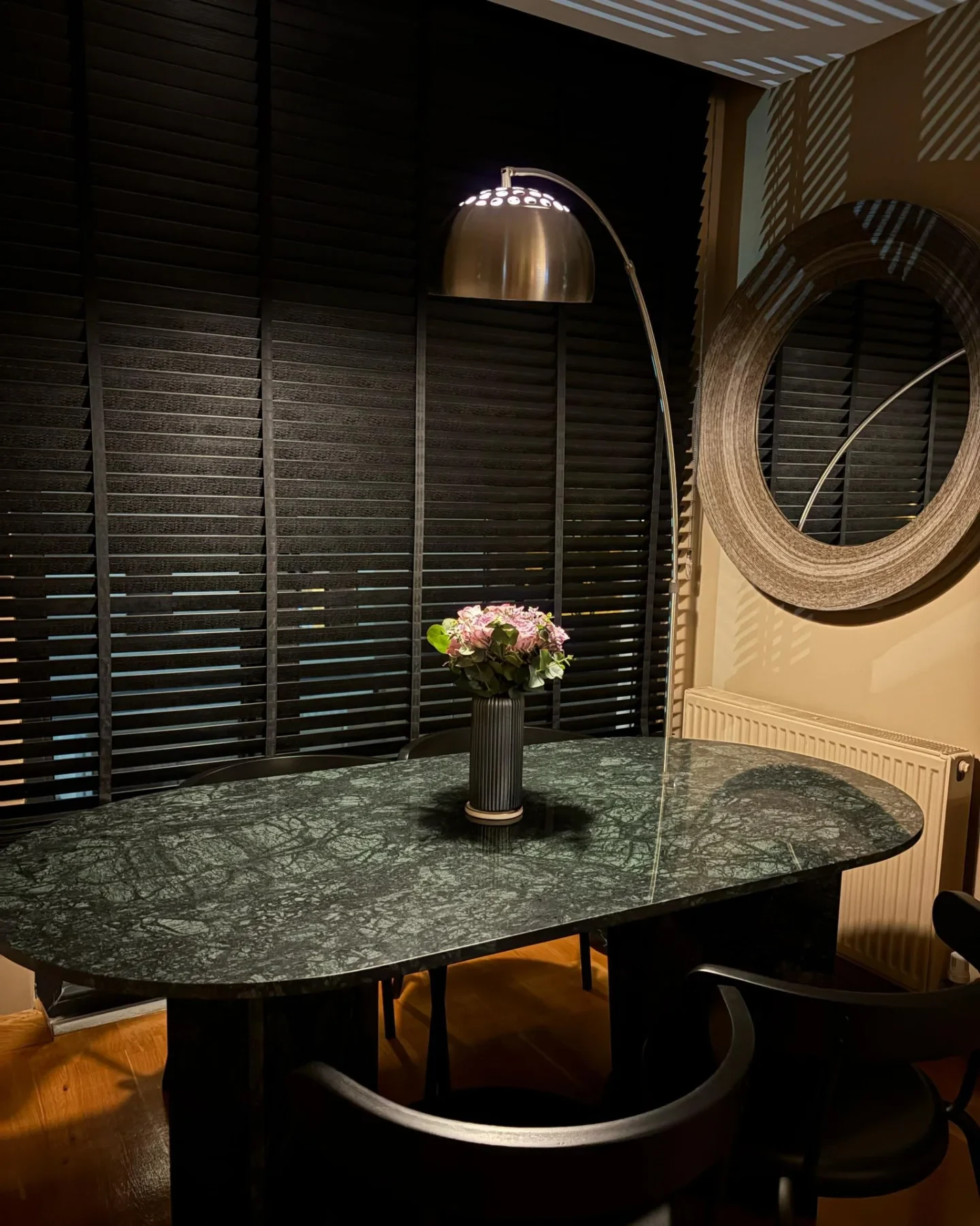 Perge Dining Table in Verde Guatemala marble: oval table with paired cylindrical pedestals
